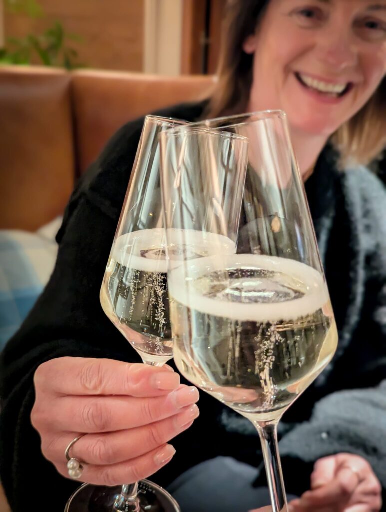 Guest relaxing with a glass of wine at Seaton House St Andrews.