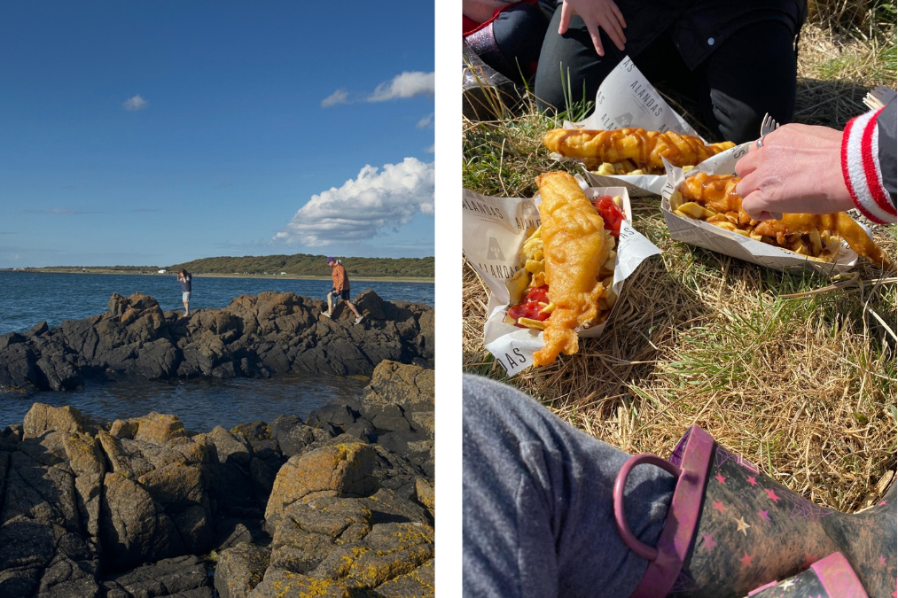 People walking across rocky coastline at Longniddry Bents with sea and distant land in background - Fish and chips from Alandas served outdoors on grass during a coastal walk