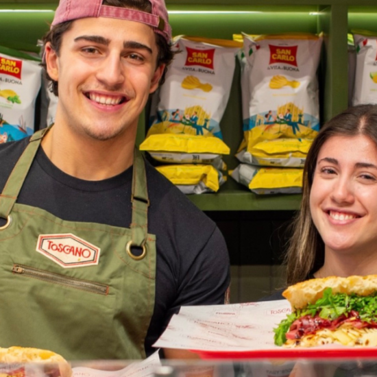 Toscano Edinburgh co-founders Yaya and Valentino behind the counter with freshly made Italian schiacciata sandwiches.
