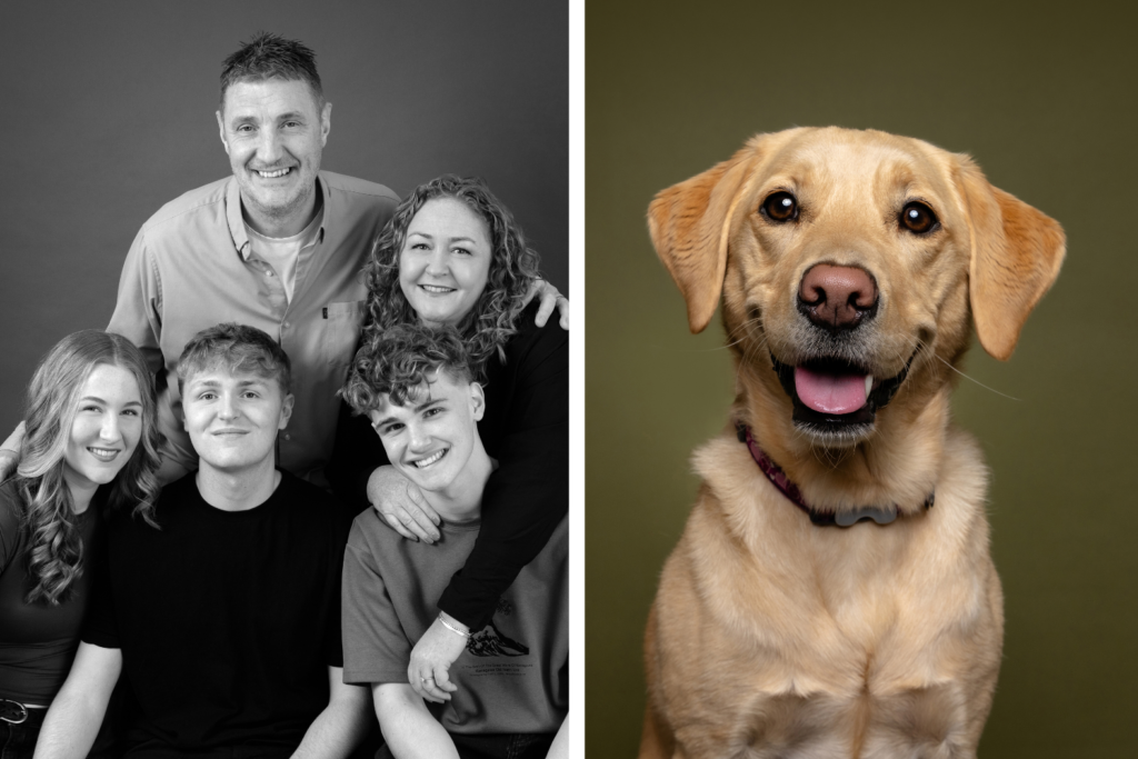 Family of five posing for a black-and-white studio portrait alongside a golden Labrador photographed by Blue Sky Photography.